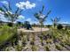 Community playground with slides and climbing structures, surrounded by green space and landscaping for Gathering enjoyment at 316 South Zuni Rd, St Cloud, FL 34771