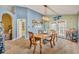 Cozy dining room featuring a wooden table, chairs, and stylish light fixture at 3455 Bellingham Dr, Orlando, FL 32825