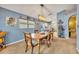 Inviting dining room with a wooden table, chairs, and a modern light fixture at 3455 Bellingham Dr, Orlando, FL 32825