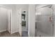 Bathroom with a glass-door shower with a tile surround and views to the main bedroom at 4115 Ruby Run, Haines City, FL 33844