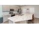 Modern kitchen with stainless steel appliances and a large center island that offers seating at 4115 Ruby Run, Haines City, FL 33844