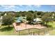 Community playground with shaded picnic areas and diverse play structures surrounded by lush trees and greenery at 4115 Ruby Run, Haines City, FL 33844