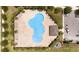 Overhead view of the community pool highlighting its unique shape, surrounding amenities, and nearby parking at 4115 Ruby Run, Haines City, FL 33844