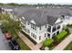 Aerial view showcasing the townhome's manicured landscaping, private porch, and vibrant community at 465 Gee Hammock Ln, Winter Springs, FL 32708