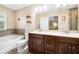 Bathroom featuring double sink, a large tub, and sleek fixtures at 465 Gee Hammock Ln, Winter Springs, FL 32708