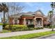 Community clubhouse with a covered porch and lush landscaping at 465 Gee Hammock Ln, Winter Springs, FL 32708