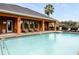 Community pool area with lounge chairs, tables, and a well-maintained pool at 465 Gee Hammock Ln, Winter Springs, FL 32708