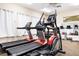 Well-equipped gym with treadmills, elliptical, weights, and mirrors for a complete fitness experience at 465 Gee Hammock Ln, Winter Springs, FL 32708