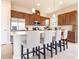 Bright kitchen featuring an island with bar seating, stainless steel appliances, and recessed lighting at 5266 Buttonsage Dr, St Cloud, FL 34772