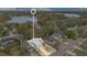 Aerial view of a home showcasing the lot lines and the location relative to the lake at 5276 Rocking Horse Pl, Oviedo, FL 32765