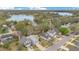 An aerial view of the homes in a lakeside community and their well-maintained lawns at 5276 Rocking Horse Pl, Oviedo, FL 32765