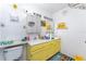 Bathroom featuring yellow vanity, dual mirrors, and bright lighting at 5291 Images Cir # 302, Kissimmee, FL 34746