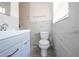 Modern bathroom featuring marble tiled walls, new vanity, and fixtures at 5513 Riordan Way, Orlando, FL 32808