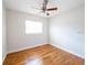 Bright bedroom with hardwood floors and a ceiling fan at 5513 Riordan Way, Orlando, FL 32808