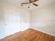 Bedroom featuring hardwood floors and closet at 5513 Riordan Way, Orlando, FL 32808