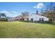 The serene backyard showcases lush lawn with ample space for recreation and relaxation at 7213 Greenville Ct, Orlando, FL 32819