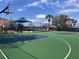 Outdoor basketball court includes two hoops and ample playing space with playground adjacent at 7213 Greenville Ct, Orlando, FL 32819