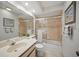 Bathroom showcasing tile walls, modern fixtures, and a large mirror over the vanity at 7213 Greenville Ct, Orlando, FL 32819