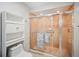 Bathroom showcasing a glass-enclosed shower, built-in shelving, and classic fixtures at 7213 Greenville Ct, Orlando, FL 32819