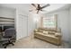 Bedroom featuring comfortable furniture, a ceiling fan, and a window with backyard views at 7213 Greenville Ct, Orlando, FL 32819