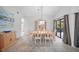 Dining room area featuring neutral walls, carpet and contemporary light fixture at 7213 Greenville Ct, Orlando, FL 32819