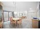 Bright and airy dining area showcasing an open floor plan with a view into the living room and foyer at 7213 Greenville Ct, Orlando, FL 32819