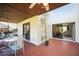 Outdoor patio area with tile flooring, covered ceiling, and a view of the living area inside at 7213 Greenville Ct, Orlando, FL 32819