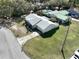 This aerial view showcases a single Gathering home, featuring a spacious backyard, mature trees and adjacent residences at 820 Dove Ridge Dr, Lakeland, FL 33803