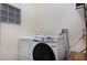 This laundry room comes equipped with Samsung washer and dryer at 9051 Treasure Trove Ln # 505, Kissimmee, FL 34747