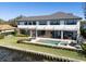 Aerial view of a backyard with a pool, spa, and outdoor dining area at 9138 Bay Point Dr, Orlando, FL 32819