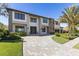 Beautifully designed home featuring manicured landscaping and modern architectural details at 9138 Bay Point Dr, Orlando, FL 32819