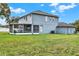 Spacious backyard featuring a screened lanai for outdoor living and entertaining at 105 Norris Pl, Casselberry, FL 32707