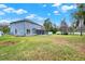 Large grassy yard with a covered lanai, perfect for outdoor activities and enjoyment at 105 Norris Pl, Casselberry, FL 32707