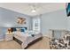 Bedroom with a ceiling fan, natural light, and floral decor at 105 Norris Pl, Casselberry, FL 32707