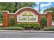 Attractive brick entrance sign for Lost Lake community surrounded by manicured landscaping at 105 Norris Pl, Casselberry, FL 32707