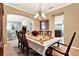 An elegant dining room with a view into the living room and kitchen, perfect for Gathering gatherings at 105 Norris Pl, Casselberry, FL 32707