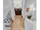 High angle shot of the foyer with tiled flooring, a chandelier, and a decorative sitting area at 105 Norris Pl, Casselberry, FL 32707