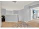 Bright upstairs hallway featuring neutral colors, an area rug, and entryways to rooms at 105 Norris Pl, Casselberry, FL 32707