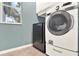 Laundry room featuring a modern washer and dryer with a window for natural light at 105 Norris Pl, Casselberry, FL 32707