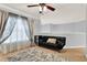 Living room with a futon, area rug, and natural lighting at 105 Norris Pl, Casselberry, FL 32707