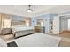 Comfortable main bedroom with a tray ceiling, neutral color palette, and access to a walk-in closet at 105 Norris Pl, Casselberry, FL 32707