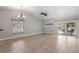 Dining area with tile flooring, bright lighting, and sliding glass doors to the outside at 1080 Abell Cir, Oviedo, FL 32765