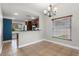 Cozy dining area next to the kitchen, featuring tile floors, bright lighting and neutral colors at 1080 Abell Cir, Oviedo, FL 32765