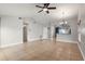 Open-concept living area with tile flooring, high ceilings, and neutral paint tones at 1080 Abell Cir, Oviedo, FL 32765