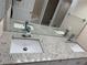 A bathroom boasting double sinks, granite countertops, and modern fixtures at 10800 Cherry Oak Cir, Orlando, FL 32817