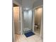 Bathroom featuring a glass-enclosed shower and neutral tile flooring at 10800 Cherry Oak Cir, Orlando, FL 32817