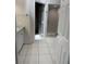 This bright bathroom features tile floors, a walk-in shower and a closet at 10800 Cherry Oak Cir, Orlando, FL 32817