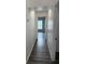 Hallway featuring luxury vinyl plank flooring and neutral paint at 10800 Cherry Oak Cir, Orlando, FL 32817