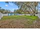 Picture of a spacious backyard fully enclosed with a white privacy fence and mature shade trees at 1416 E 20Th St, Sanford, FL 32771
