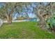Expansive, lush backyard featuring mature trees and a full privacy fence surrounding the property at 1416 E 20Th St, Sanford, FL 32771